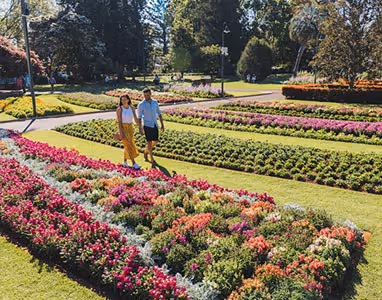 Image of the Toowoomba Carnival of Flowers with people strolling through.